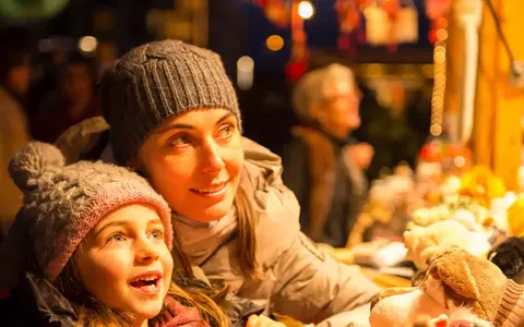 mother and daughter at christmas market