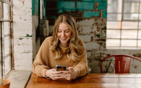Person using their Moneyboat account on their phone