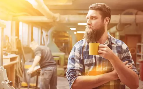 Self employed tradesman having morning coffee