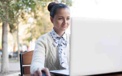 Person Using Notebook During Work Outdoor