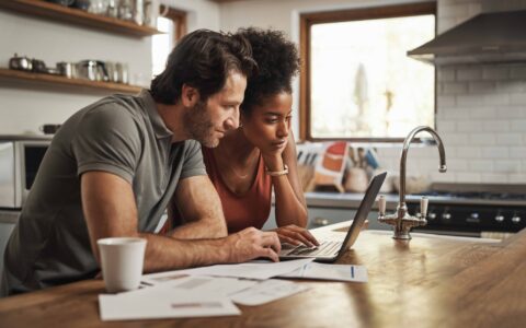 Couple looking at laptop