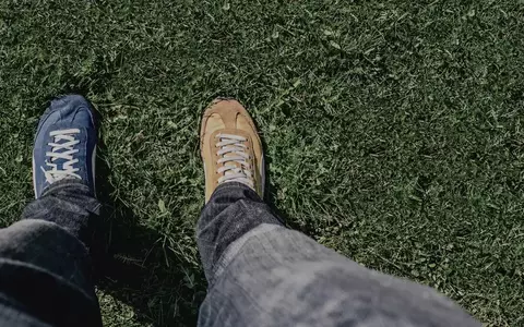 Looking down at two different types of shoes