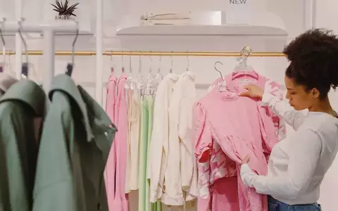 Person looking at a dress in the store